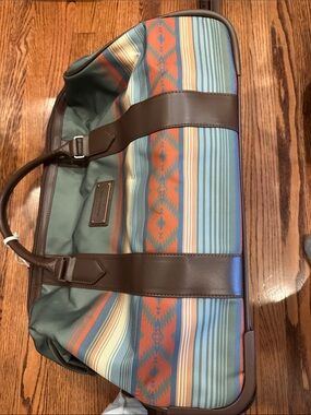 Pendleton rolling duffle Travel Bag - Brown Leather Trim . Beautiful stripes.